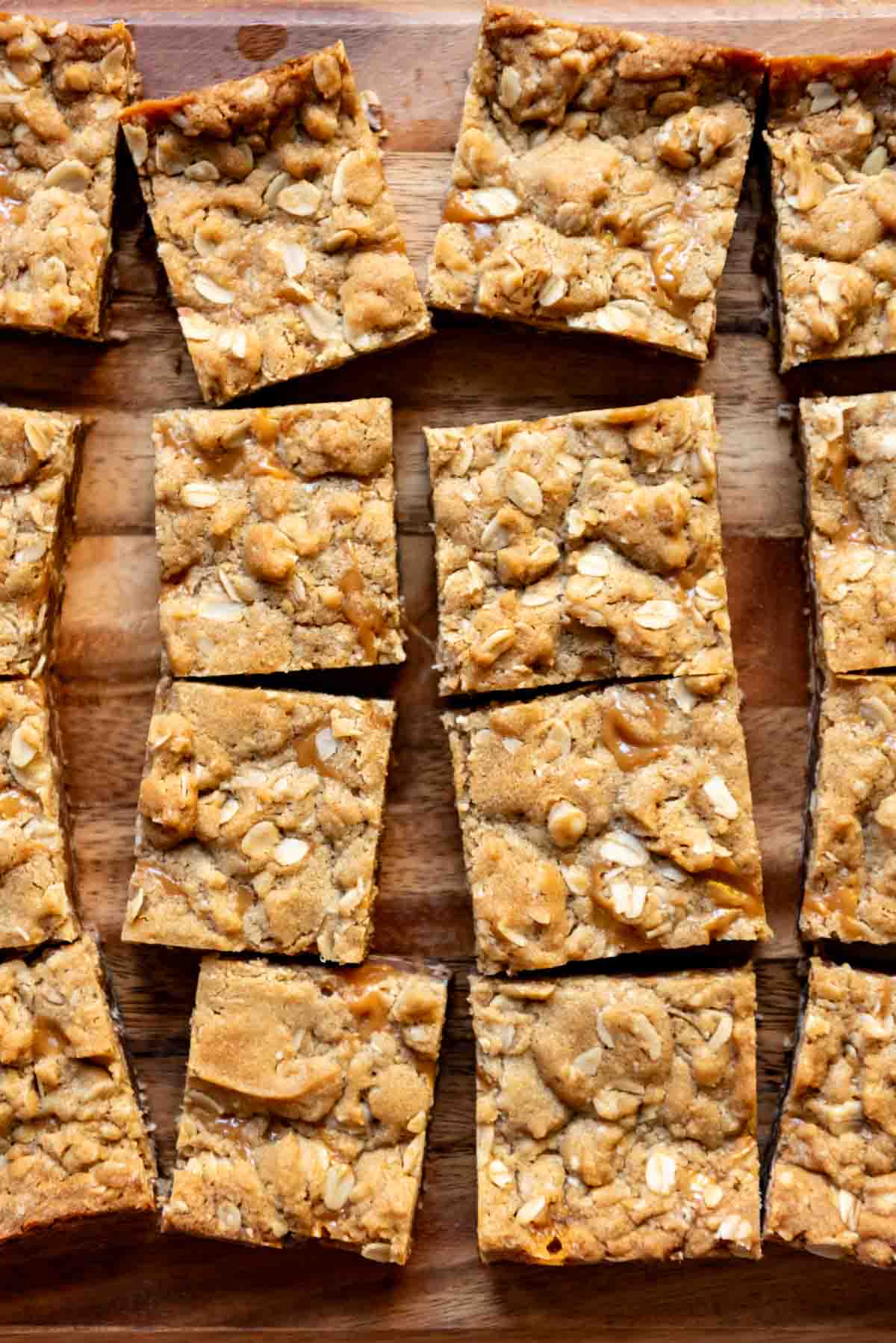 An image of oat and caramel bars cut into squares.