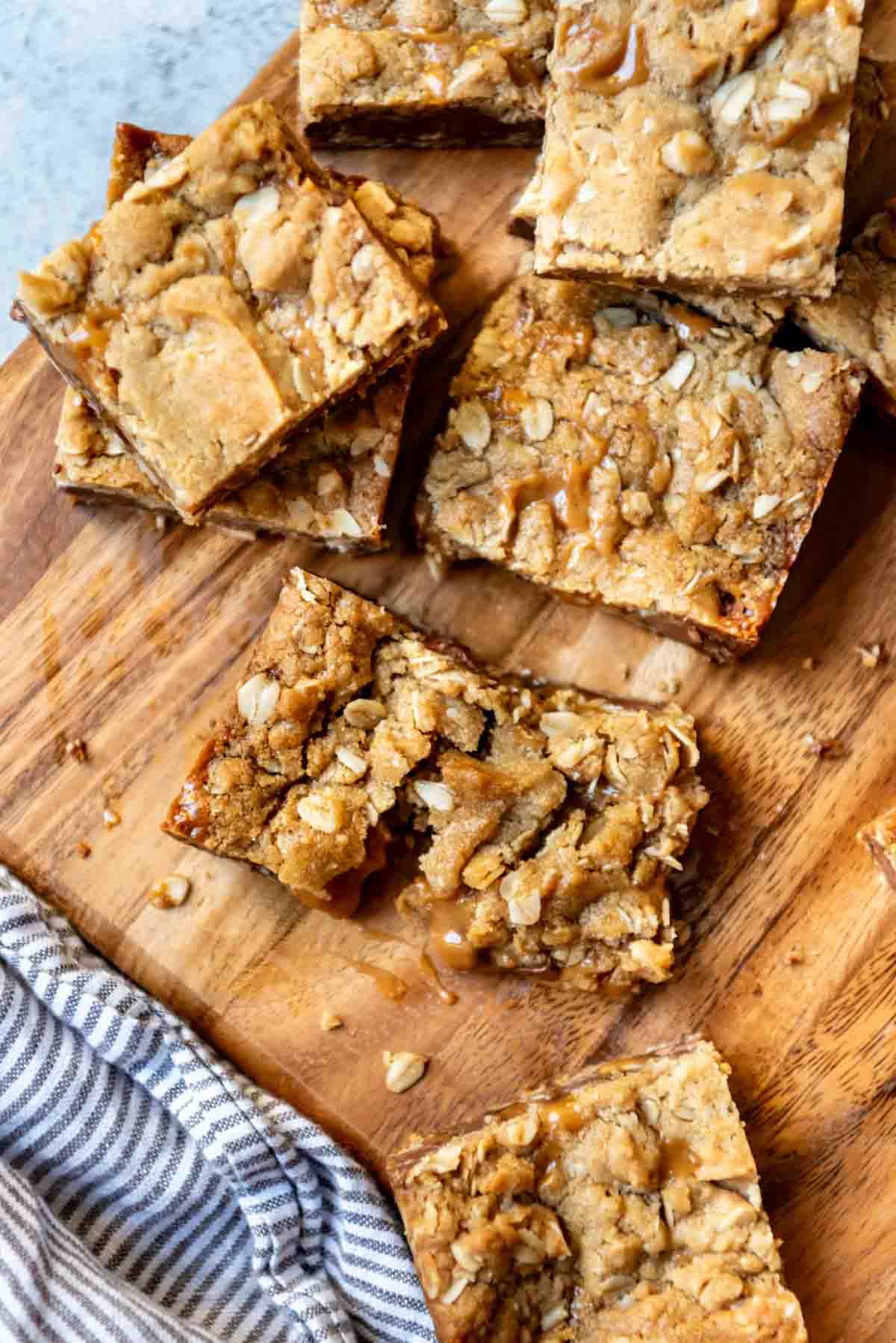 An image of oatmeal cookie bars with caramel and chocolate.