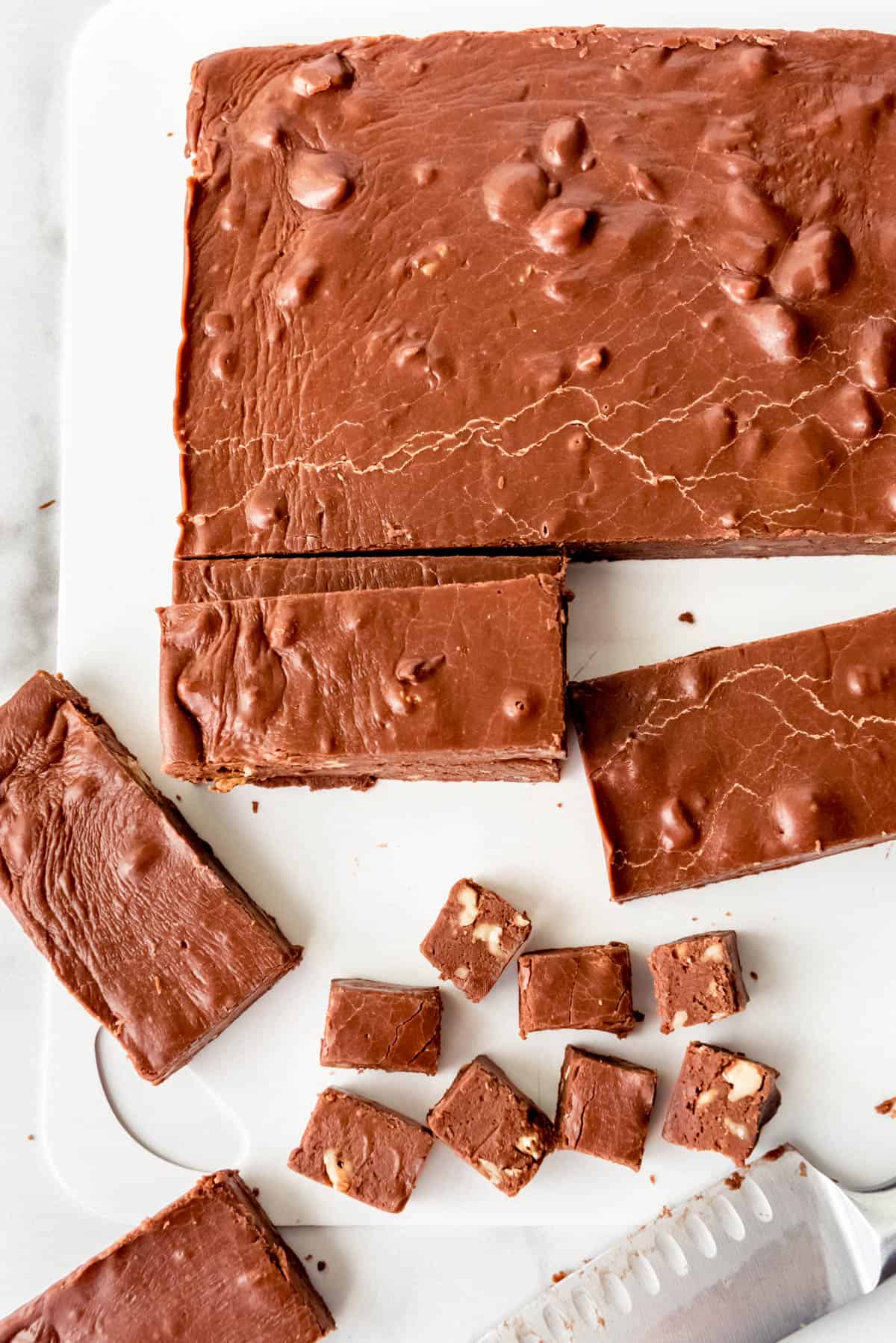 An image of old-fashioned chocolate fudge with walnuts.