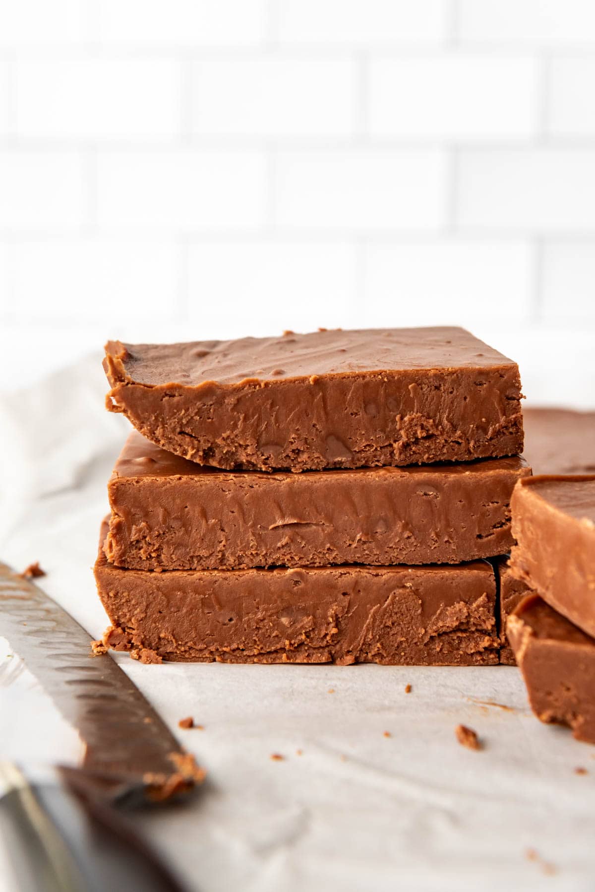 An image of an easy fudge recipe that has set and been cut into bricks to be stacked on top of each other.