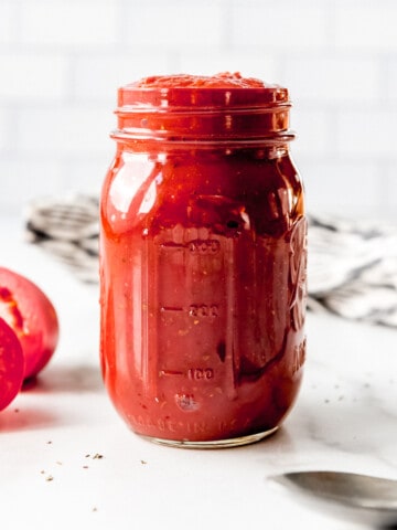 An image of a jar of homemade pizza sauce.