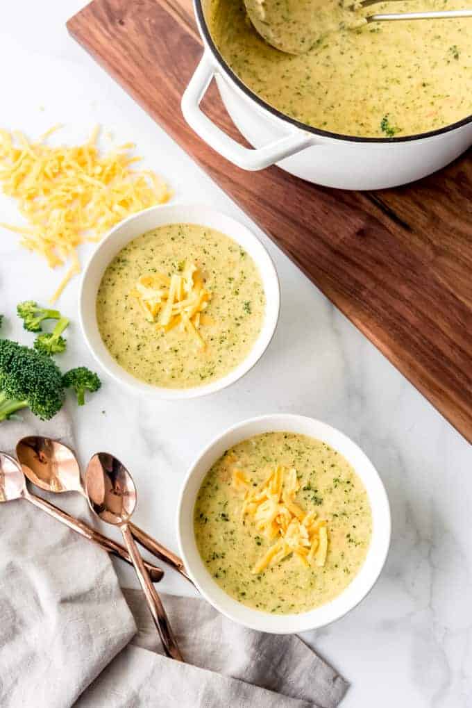 An image of bowls of homemade broccoli cheese soup.