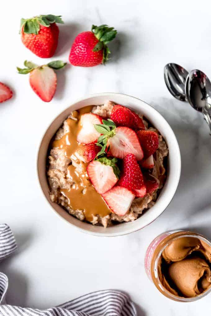 An image of a bowl of homemade oatmeal with fruit.