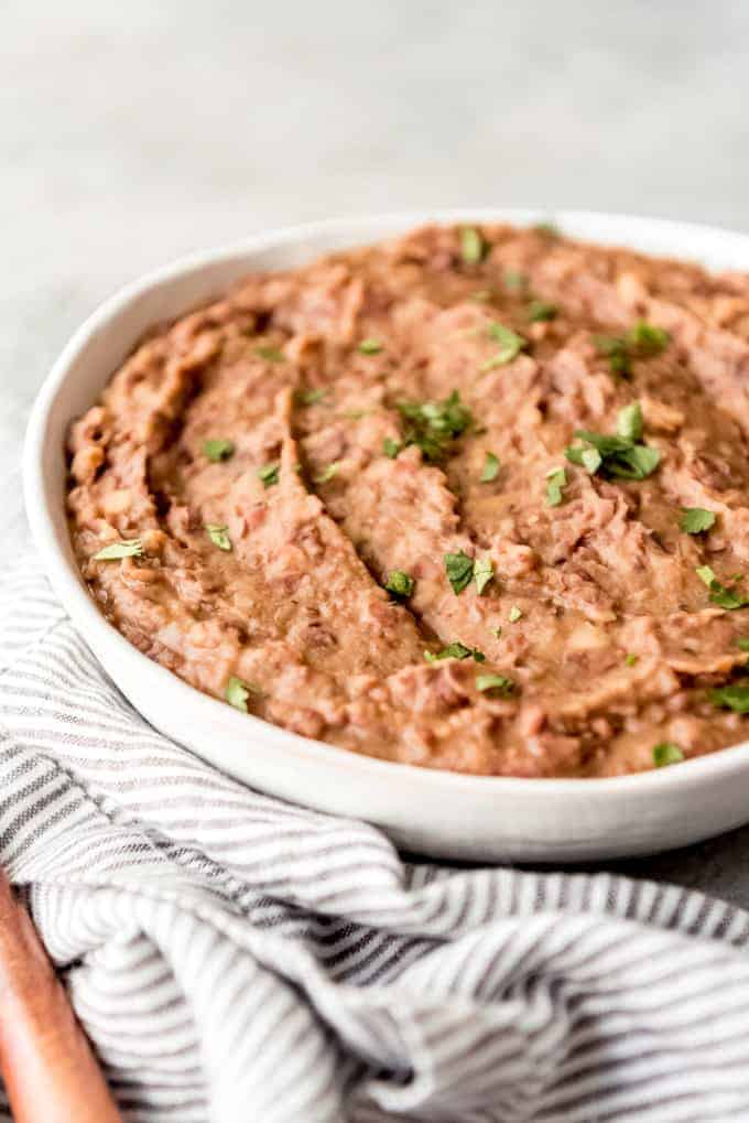An image of a bowl of creamy homemade refried beans.
