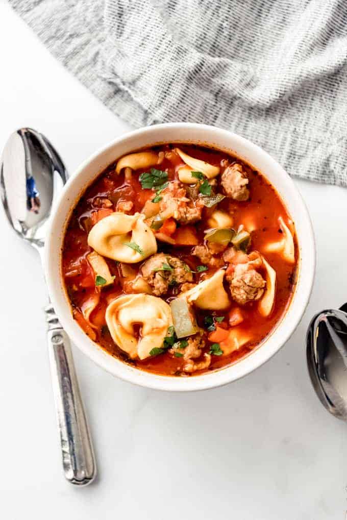 An image of a bowl of easy tortellini sausage soup.