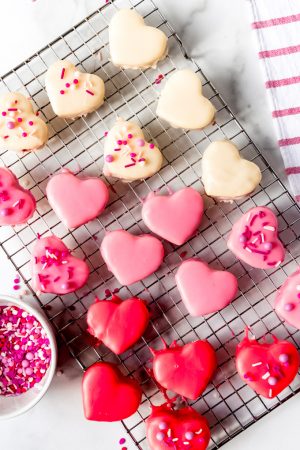 An image of red, white, and pink heart-shaped petit fours.