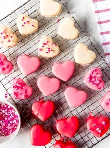 An image of red, white, and pink heart-shaped petit fours.