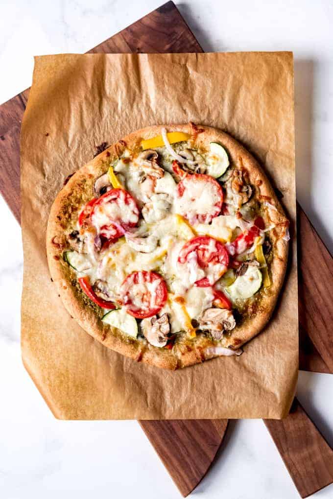 An image of a homemade veggie pizza on whole wheat dough.