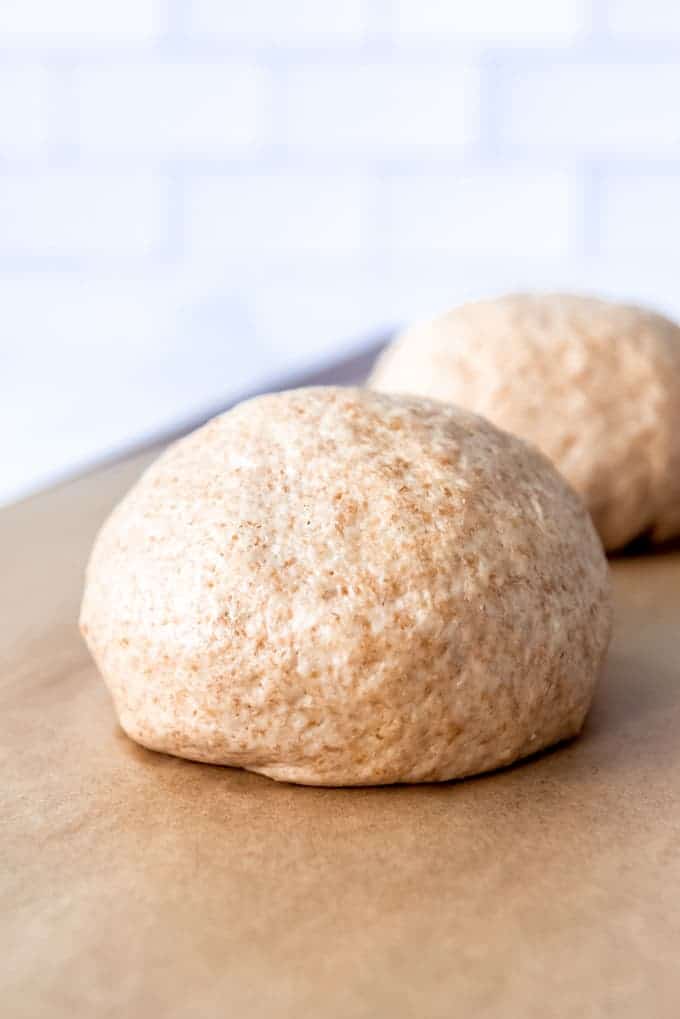 An image of a ball of homemade whole wheat pizza dough.