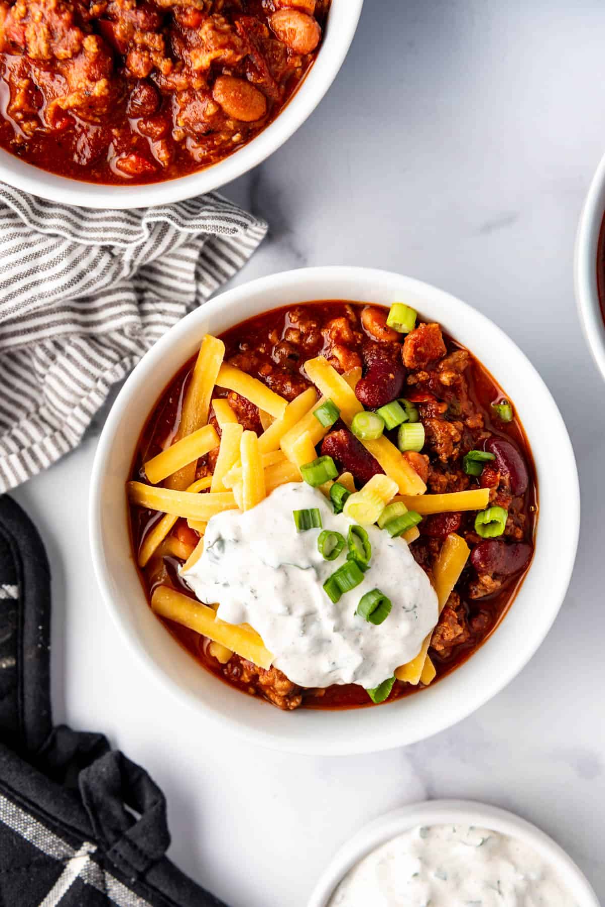 An overhead image of a bowl of chili.