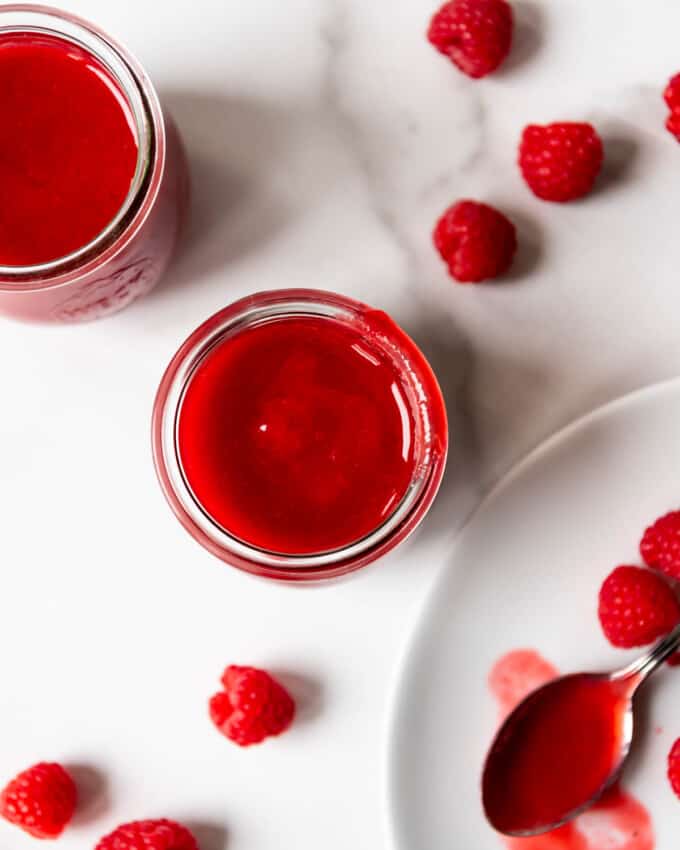An image of a bright red fresh raspberry coulis for pouring over desserts.