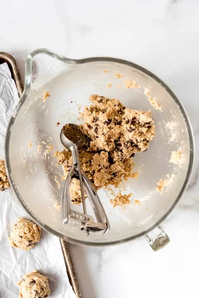 An image of a mixing bowl filled with homemade cookie dough.