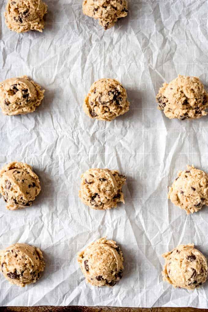 An image of oatmeal chocolate chip cookie dough on a baking sheet.