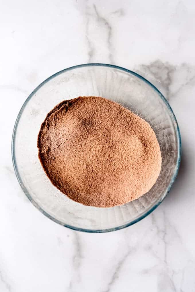 An image of sifted almond meal, cocoa powder, and powdered sugar.