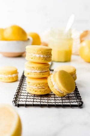 An image of lemon macarons stacked on top of each other.