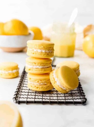 An image of lemon macarons stacked on top of each other.