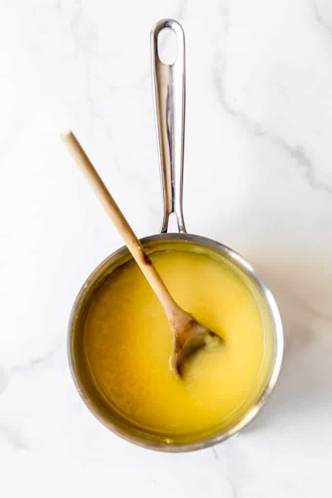 lemon mixture in a saucepan with a wooden spoon