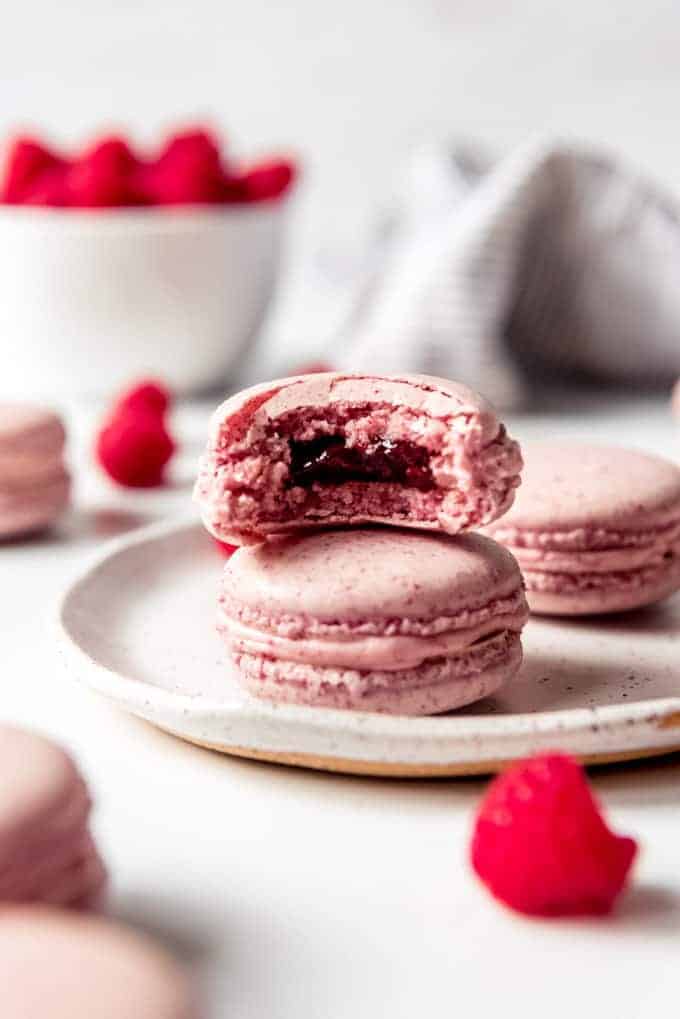 An image of pink macarons stacked on top of each other.