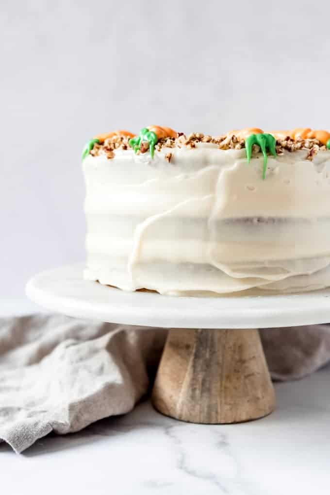An image of a carrot cake frosted with homemade cream cheese frosting.