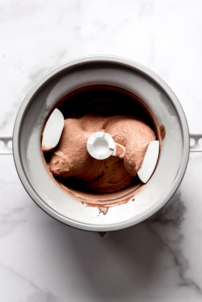 A KitchenAid ice cream bowl attachment filled with homemade chocolate ice cream.
