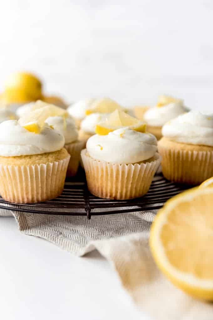 An image of lemon cupcakes on a wire cooling rack.