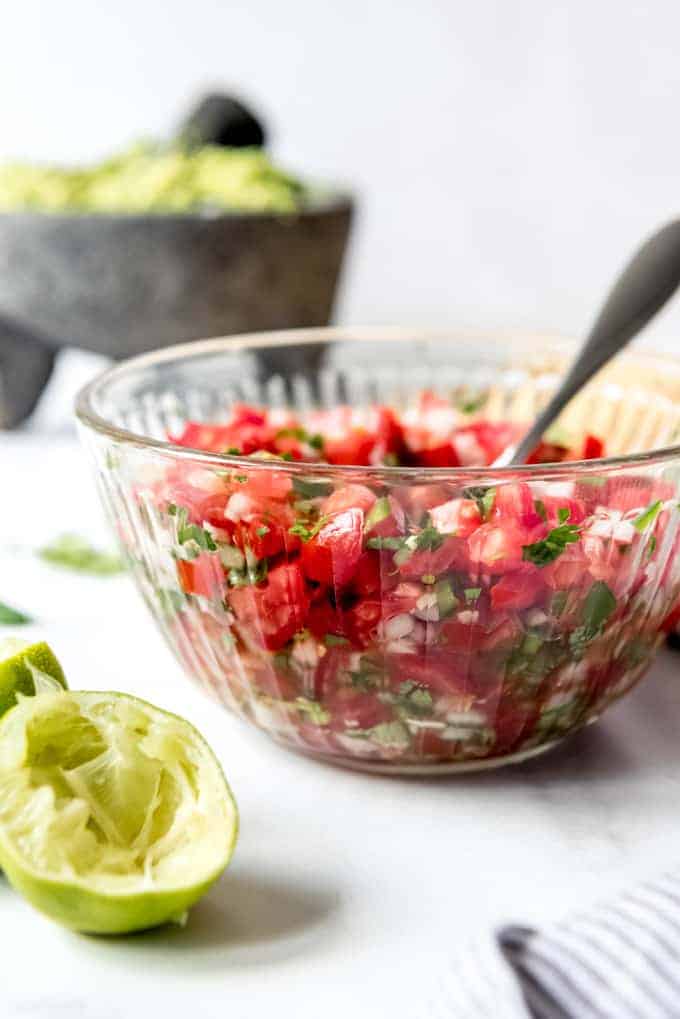 An image of a bowl of homemade authentic pico de gallo in a bowl.