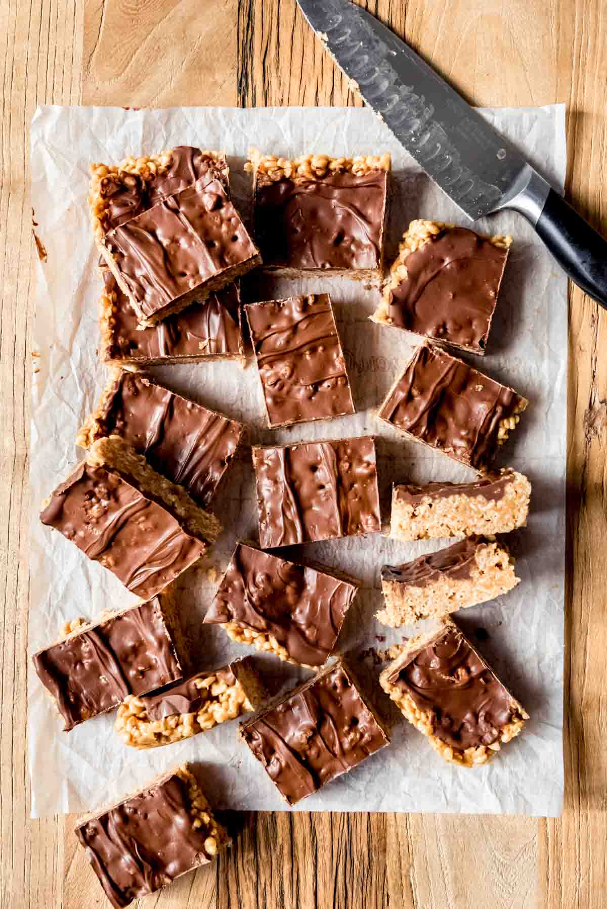 An image of scotcheroos bars arranged haphazardly on a cutting board.