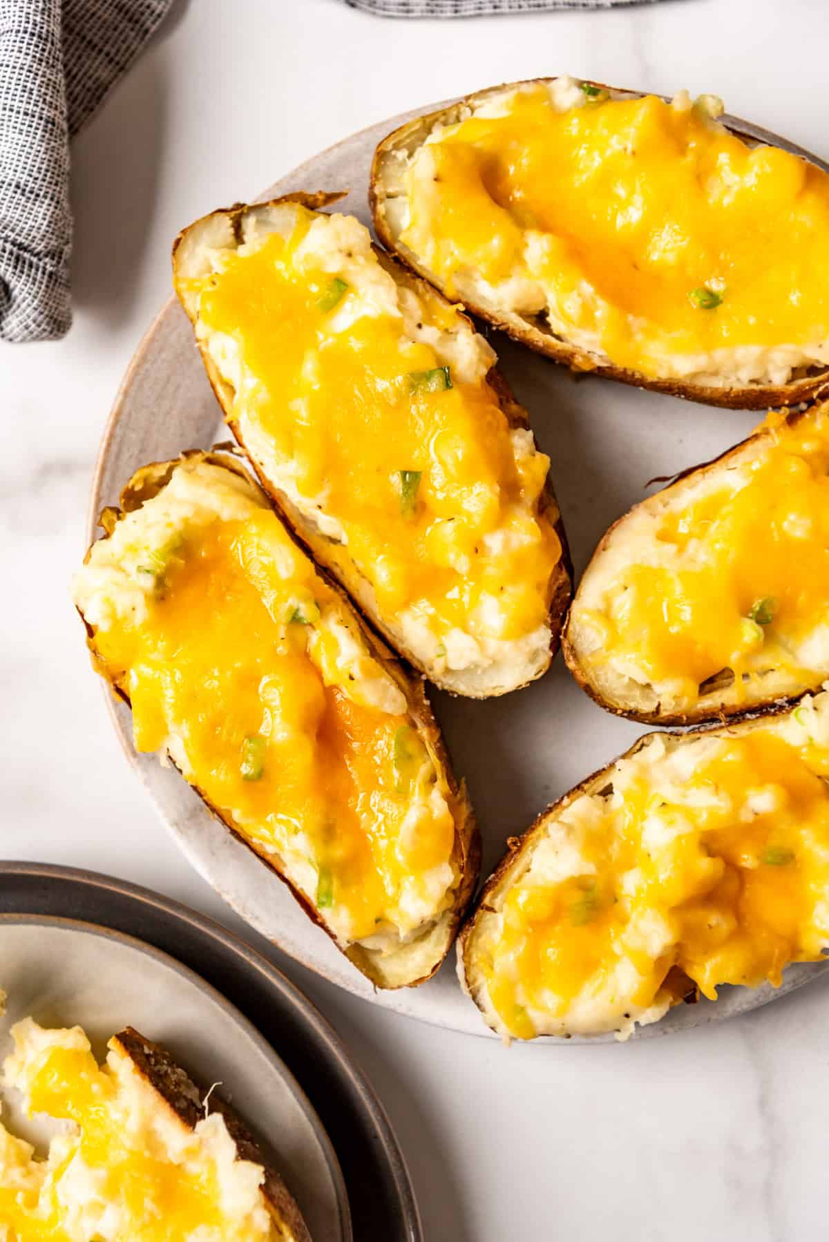 An image of twice baked potatoes on a plate.