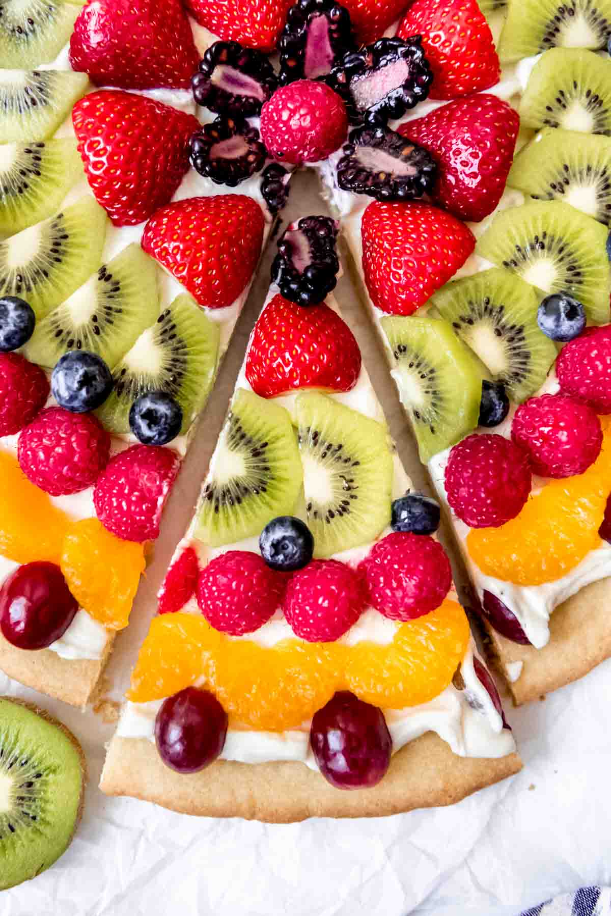 An image of a slice of easy fresh fruit pizza.