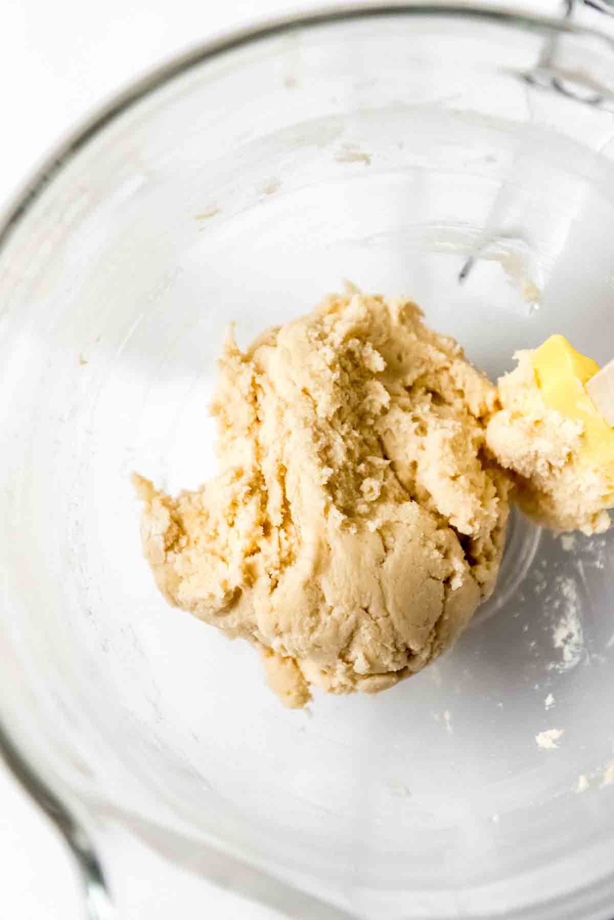 Sugar cookie pizza dough in a bowl.