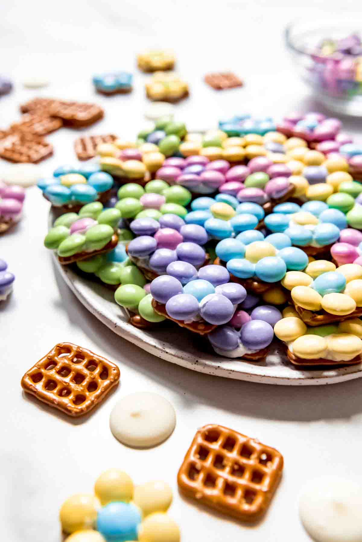 An image of Spring pretzel bites made with M&M's arranged in the shape of flowers and secured with white chocolate.