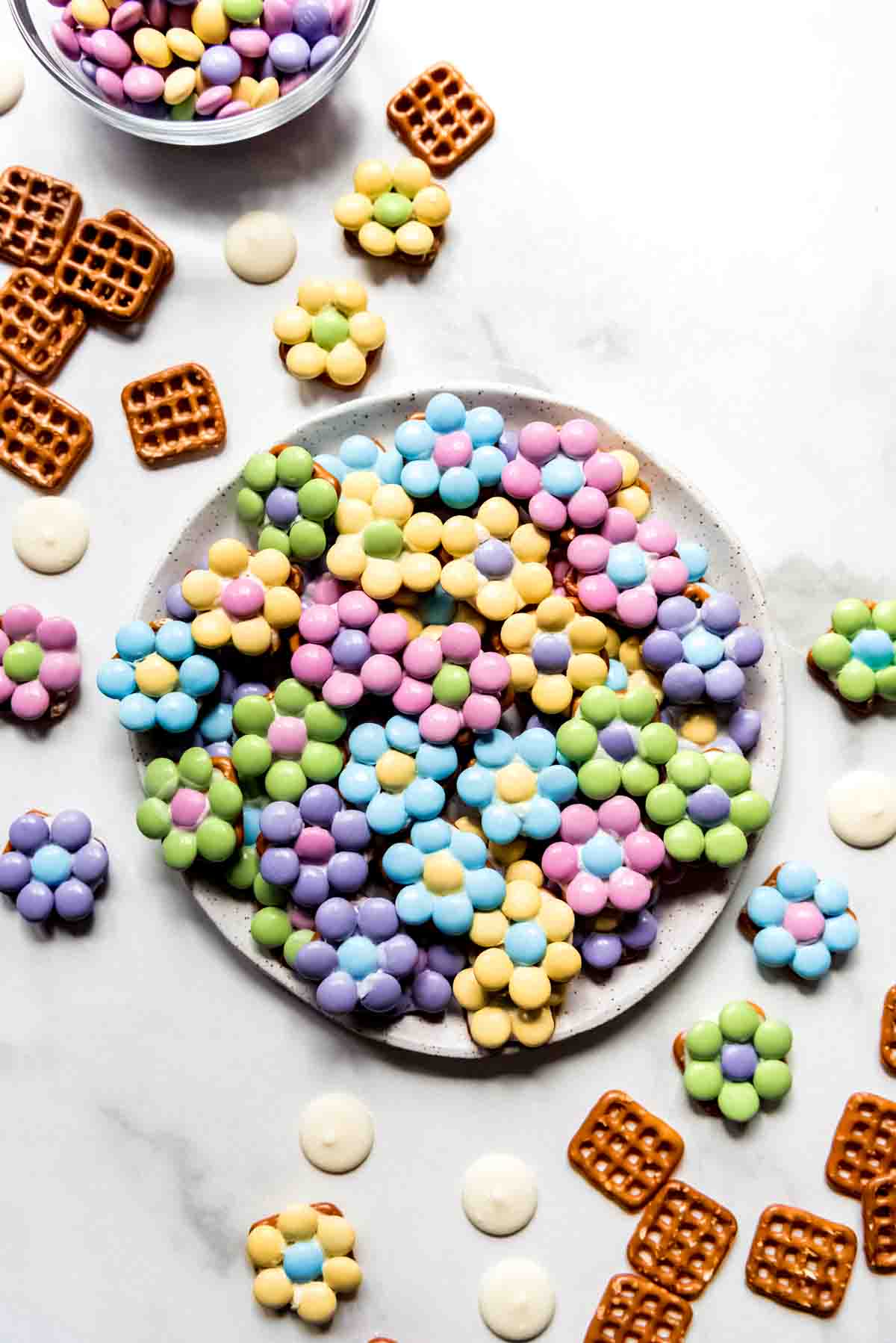 An image of an easy Easter treat for kids to make at home with pretzels, white chocolate, and M&M's.