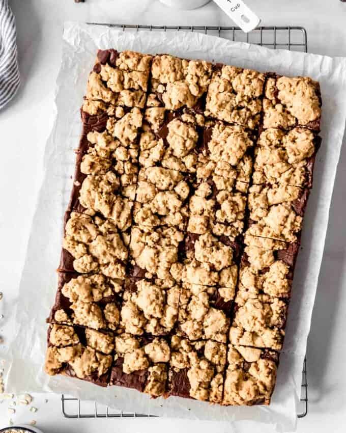 An overhead image of a batch of oatmeal fudge bars cut into squares.