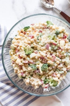 A glass bowl filled with macaroni salad.