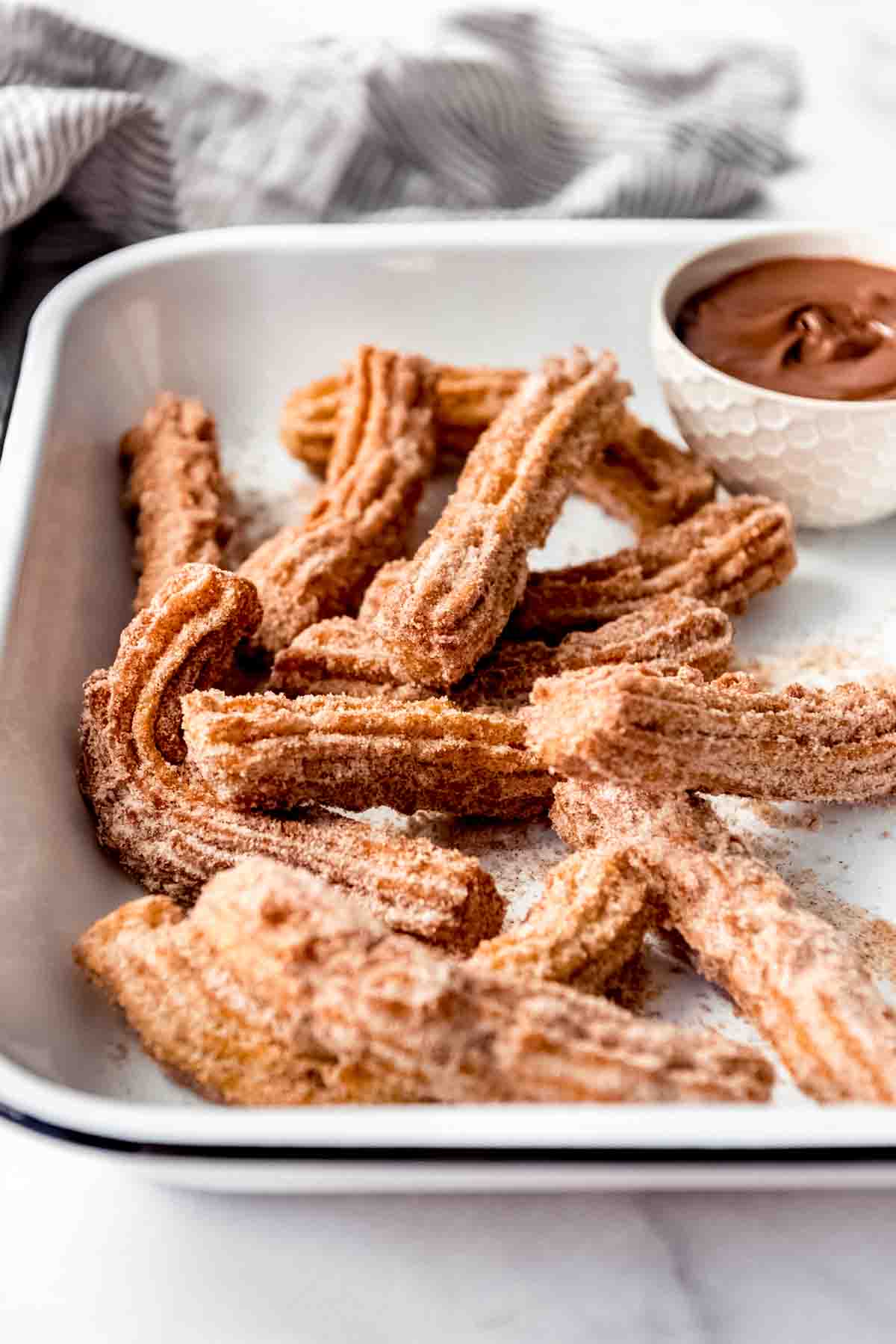 Crispy fried Mexican churros with Nutella for dipping.