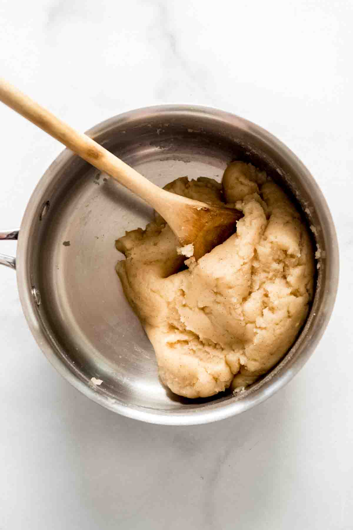 Churro dough in a saucepan.