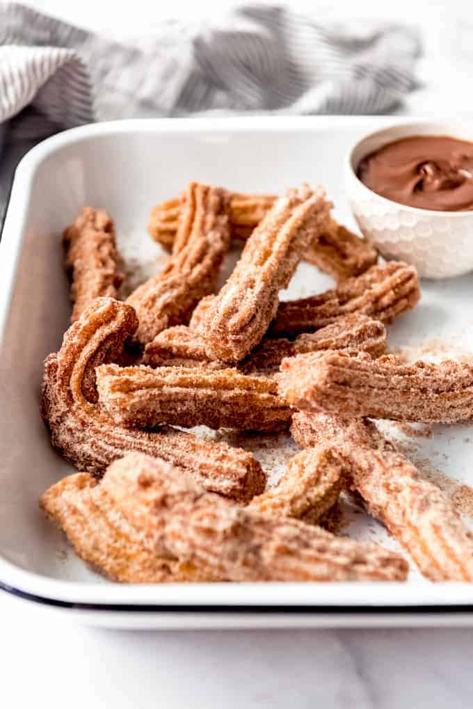 Crispy fried Mexican churros with Nutella for dipping.