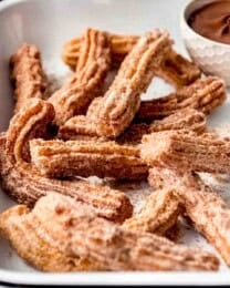 Crispy fried Mexican churros with Nutella for dipping.