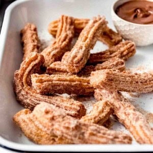 Crispy fried Mexican churros with Nutella for dipping.