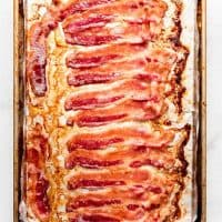 Cooked bacon on a baking sheet lined with foil