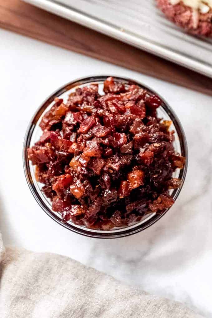 A bowl filled with chunky bacon jam.