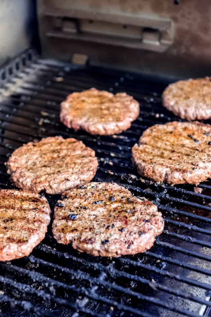 Burgers on a grill.