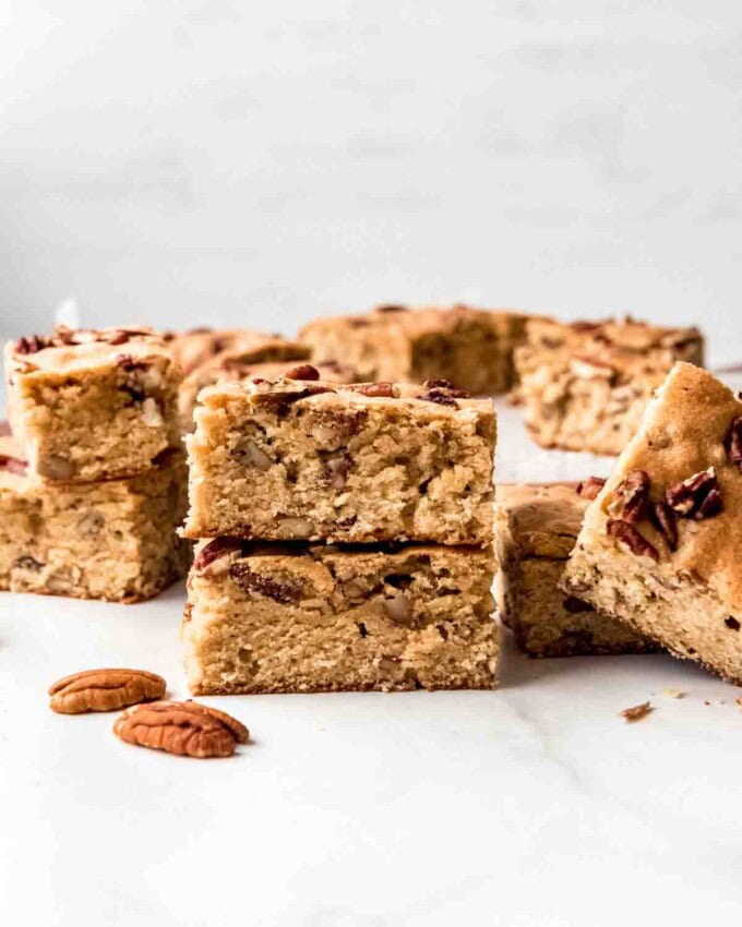 Maple pecan blondies stacked on top of each other.