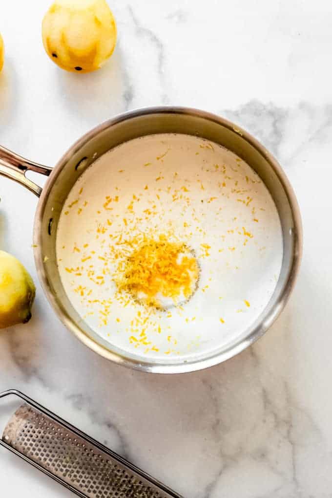 Milk, cream, sugar, and lemon zest in a saucepan.