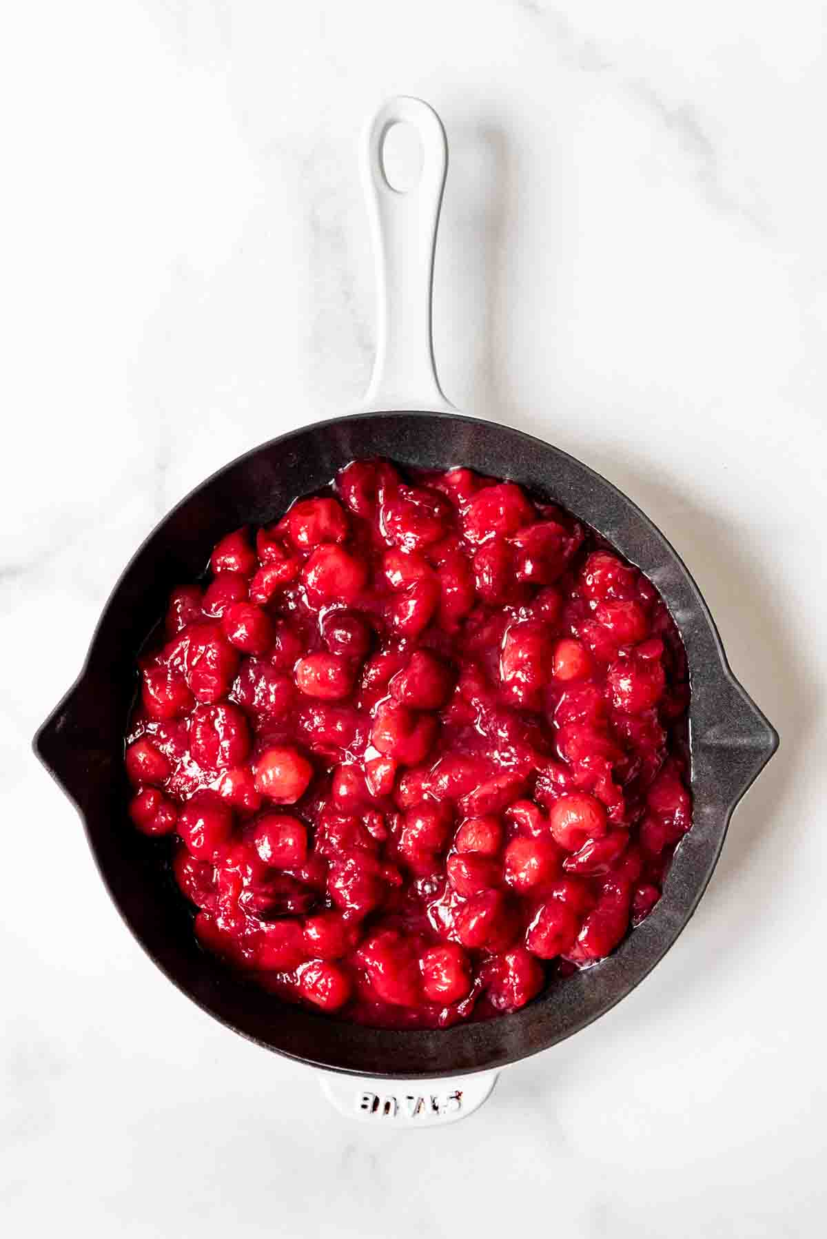 Cherry pie filling in a pan.