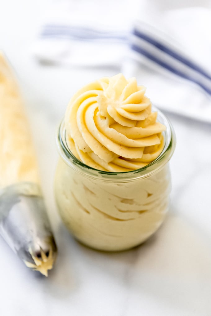Swirls of vanilla pastry cream in a glass jar.