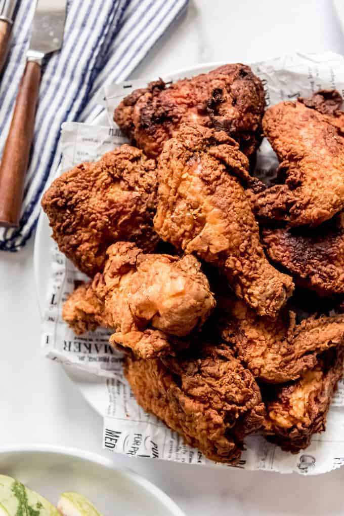 A close image of pieces of fried chicken on a plate.