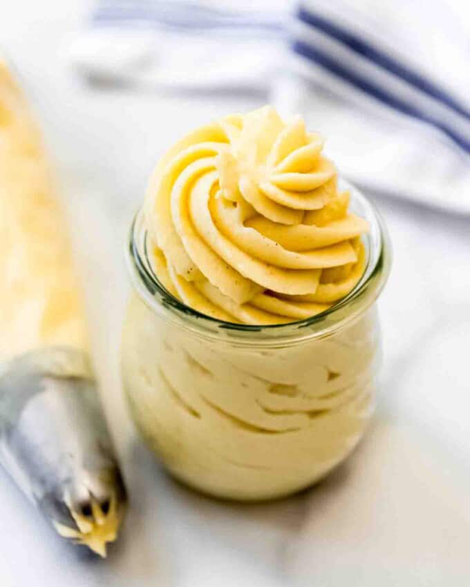 Swirls of vanilla pastry cream in a glass jar.