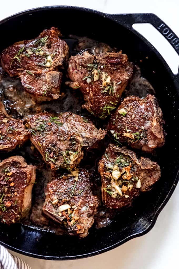 Pan seared lamb chops in a cast iron skillet.