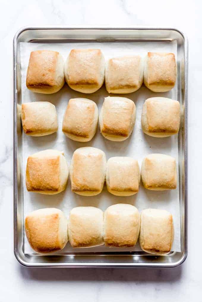 Fresh rolls on a baking sheet.